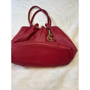 Michael Kors Red leather shoulder bag with gold tones.